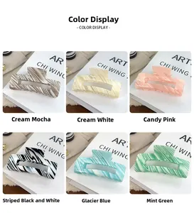 Detail showcasing variety of colorful candy-colored striped claw clips in marble patterns
