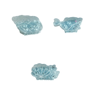 Blue ocean-themed hair claw clip set with whale and seashell designs and glitter