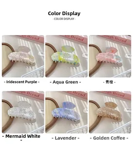 Detail of luxury acetate hair claws with rhinestone flower designs in six vibrant colors