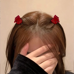 Red cat-shaped acetate hair claw clips shown on a model for a stylish look