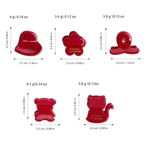 Size chart for 5 red acetate mini hair claws including heart, flower, and bear shapes