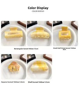 Détails de pinces à cheveux à texture marbrée jaune dans diverses formes géométriques