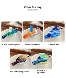 Detailed grid view of colorful acetate bird hair claws showing glossy texture and animal motifs