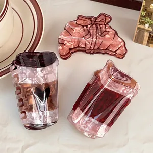 Lot de trois pinces à cheveux café et croissant en acétate ambre et rose nacré