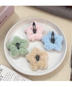 Set van vier pluchen ster-haarspeldjes in de kleuren roze, blauw, groen en beige