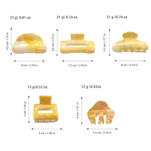 Cinq pinces à cheveux en acétate marbré jaune avec détails sur les tailles et poids