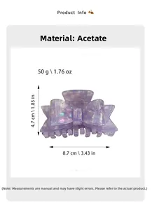 Macro detail of purple acetate bow hair claw clip showing size and iridescent texture