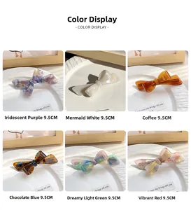 Detail of 9.5cm acetate bow hair clips in six assorted colors with spring clamp