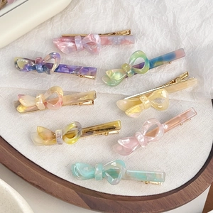 Set di 8 fermagli per capelli a fiocco in acetato marmorizzato pastello con base in metallo dorato