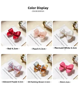Détails des barrettes nœud en acétate de 4,3 cm en six couleurs et textures marbrées