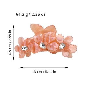 Grande pince à cheveux fleur en acétate rose avec texture marbrée et strass