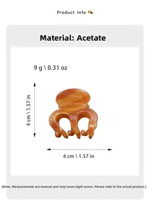Detail showing amber orange cellulose acetate hair claw clip dimensions and 9g weight