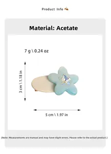 Detail view of a 5cm light blue acetate flower hair clip with size dimensions and weight