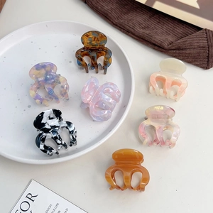 Set of 6 premium acetate hair claw clips in marbled and floral patterns for ponytails