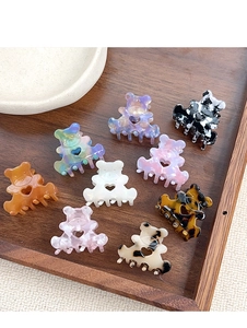Détails d'un lot de pinces à cheveux en forme d'ours en acétate aux motifs variés et colorés