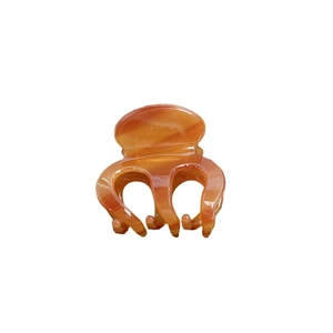 Minimalist amber acetate claw clip with tortoiseshell pattern for high ponytail styles