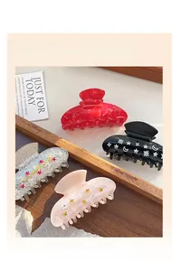 Détails de pinces à cheveux en acrylique aux motifs colorés de lune et d'étoiles