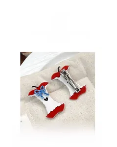 Detail of apple core hair claw clip with blue plaid bow and heart on linen fabric