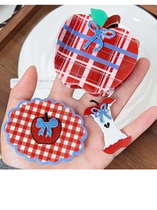 Detailed set of three red plaid apple hair clips featuring a creative shark claw and bow