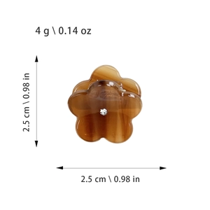 Mini pince à cheveux fleur ambre avec cristal central et texture en acétate