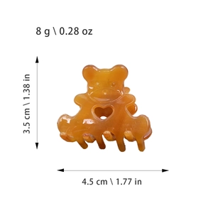 Pince à cheveux ours en acétate ambre avec cœur découpé, dimensions de 4,5 cm de large