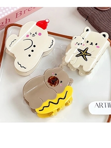 Three cute cartoon bear hair claws in a ceramic plate with cozy cream aesthetic