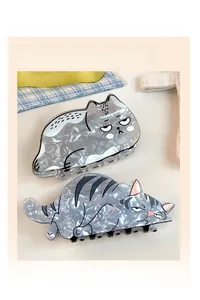 Close-up of grey marble texture acetate cat hair claws with cute cartoon designs