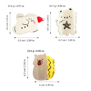 Cute gingerbread man and bear hair claw clips in acetate, showing various cartoon designs