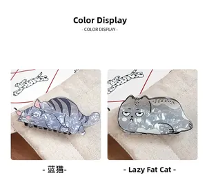Detail of cute marble-textured blue and grey fat cat acetate hair claws for women