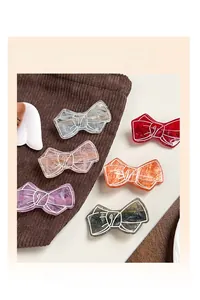 Detailed macro view of acrylic hair claw clips with elegant marble pattern texture