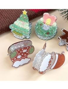 Detailansicht der glitzernden Acryl-Haarklammern mit Weihnachtsmotiven und Metallfedern