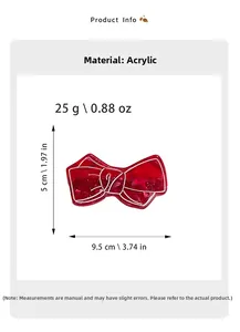 Detail view of a vintage red acrylic bow hair clip with elegant marble texture patterns