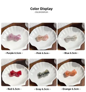Detailed grid view of 6.5cm marble texture bow hair clips in six vibrant colors