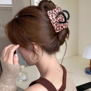French leopard print claw clip for women in a stylish back of head hair style