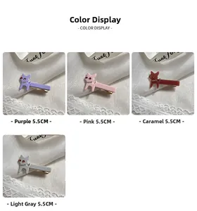 Dettaglio di fermagli per capelli a forma di cane 5,5 cm in viola, rosa, caramello e grigio