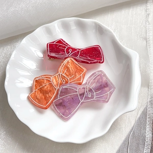 Vintage acrylic bow hair clips with marble texture in red, orange, and purple styles