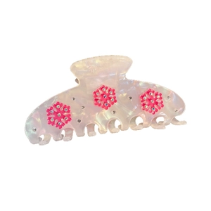 Elegant snowflake hair claw with pink floral accents and shimmering rhinestones