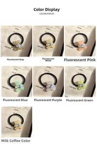 Detail view of acrylic bear hair ties with heart-shaped gems in seven vibrant colors