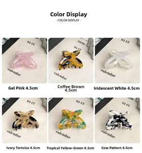 Six colors of 4.5cm acetate butterfly hair claws shown on a minimalist stand