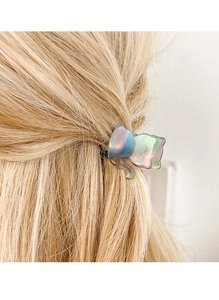 Close-up of cat-shaped acetate hair claw with iridescent gradient and pearl luster