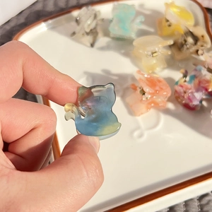 Cute acetate cat hair claw clips in assorted marble patterns for women and girls
