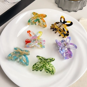 Set of 6 colorful hollow butterfly acetate hair claws in various marble patterns