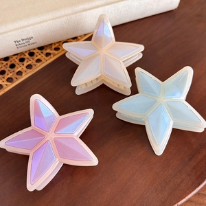 Set de 3 pinzas para el pelo con forma de estrella en blanco perla, azul y rosa
