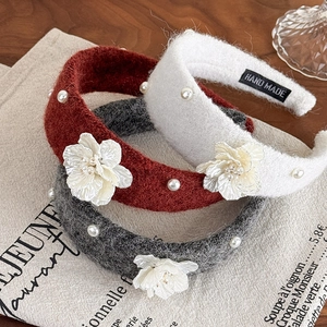 Three-piece knit headband set with pearls and camellia flowers in red, white, and grey