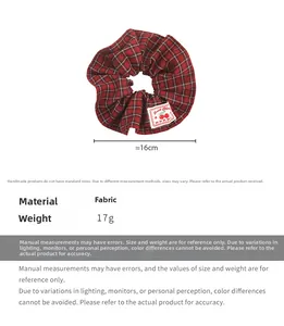 Detail view of red and black plaid scrunchie with sweet cherry fabric label and 16cm size info