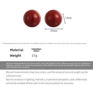 Macro detail of 25mm large red faux pearl earrings with size measurements and dimensions