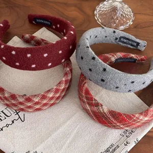 Close-up of handmade wide padded headbands in vintage red polka dot and plaid fabrics