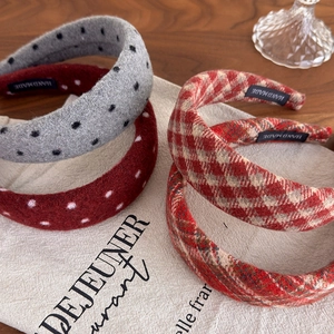 Detailed view of handmade vintage red polka dot and plaid cloth headbands set