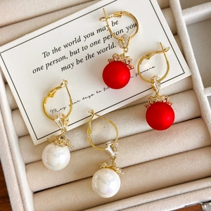 Chinese New Year festive pearl drop earrings with red matte spheres and golden floral caps