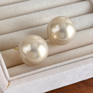 Macro shot of 25mm large round baroque pearls with premium glossy finish in jewelry box